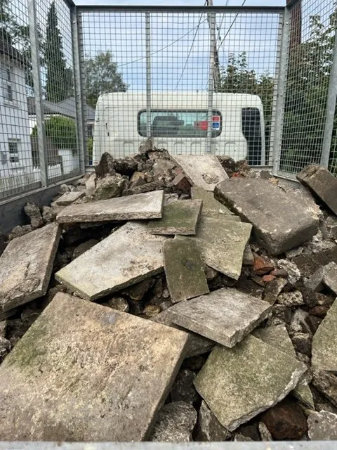 PIle of rubble on the back of a lorry.